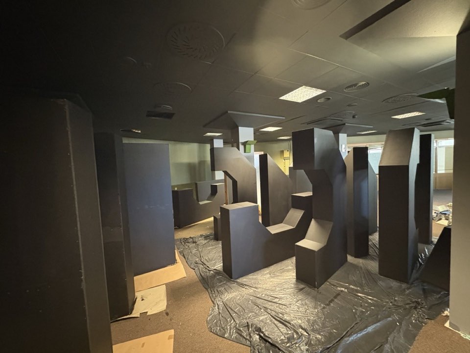 Partition walls being installed in an interior during fit-out.