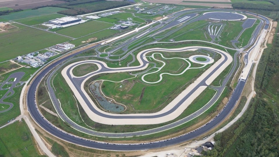 Aerial view of a test track with a circuit and handling area.